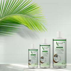 Avya Organic Extra Virgin Coconut Oil bottles with a coconut palm leaf in natural sunlight